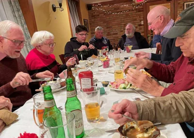 Happy diners, particularly Chapter 1st Vice President John Amrhein (smiling, right).