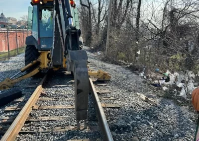 After weeks of delays in material deliveries, followed by weeks of rain and cold, the crew was able to resume work. The team began dropping the new rails, ready for placement.