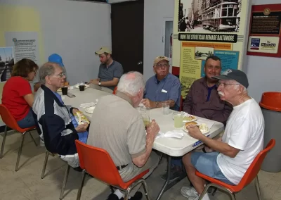 Chapter members and guests socializing as they enjoy their meals.