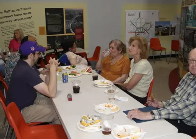 Chapter members and guests socializing as they enjoy their meals.